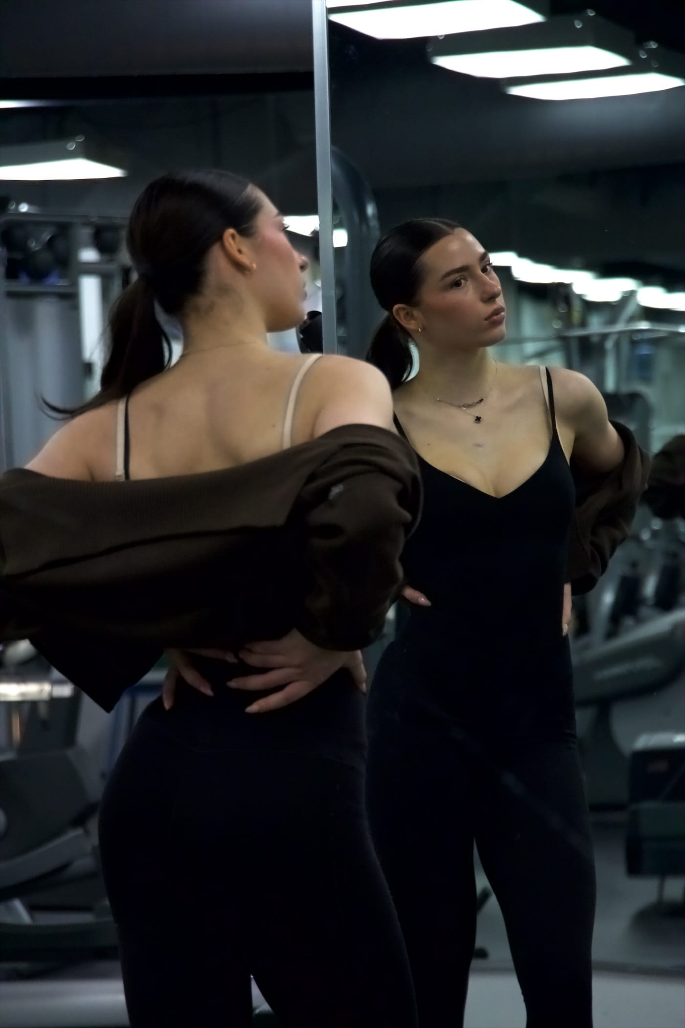 Ena in the gym, reflected in a mirror